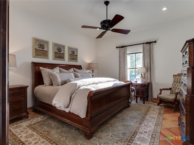 tiled bedroom featuring ceiling fan