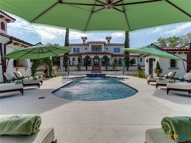 view of swimming pool featuring a patio and pool water feature