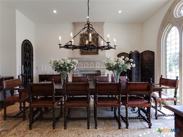 dining area featuring a notable chandelier and a healthy amount of sunlight