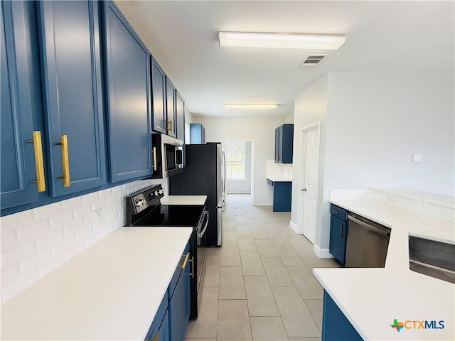 4302 Jack Barnes Ave, Killeen, TX 76549 - kitchen featuring appliances with stainless steel finishes, blue cabinetry, backsplash, and light countertops