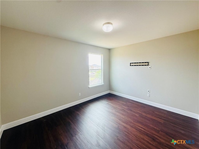 4302 Jack Barnes Ave, Killeen, TX 76549 - spare room with dark wood finished floors and baseboards