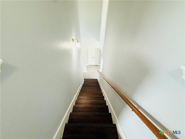 4302 Jack Barnes Ave, Killeen, TX 76549 - staircase with baseboards and wood finished floors