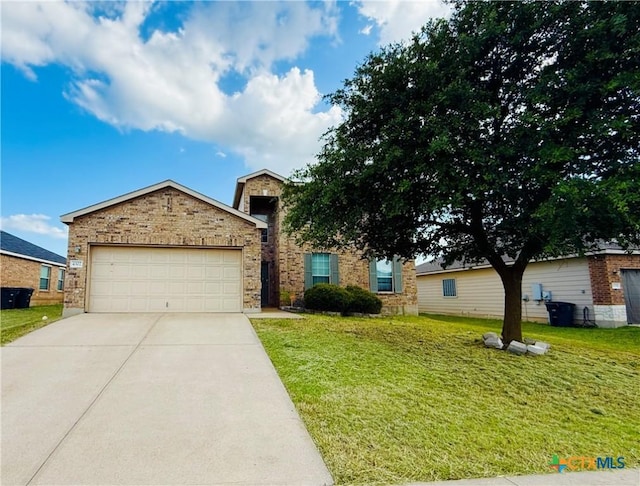 4302 Jack Barnes Ave, Killeen, TX 76549 - view of front of property featuring concrete driveway, a front lawn, a garage, and brick siding