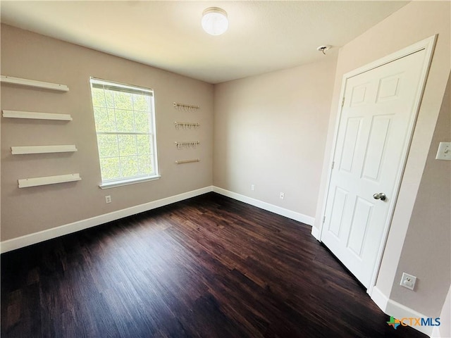 4302 Jack Barnes Ave, Killeen, TX 76549 - unfurnished room with dark wood finished floors and baseboards