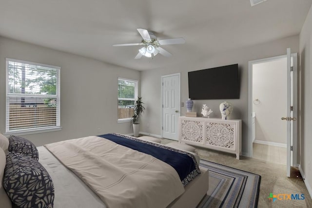 2121 Keystone Dr, New Braunfels, TX 78130 - carpeted bedroom with baseboards and a ceiling fan