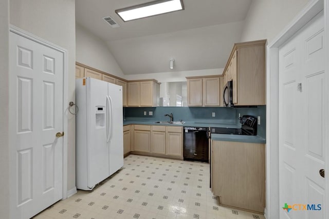 2121 Keystone Dr, New Braunfels, TX 78130 - kitchen featuring black appliances, a sink, light brown cabinetry, lofted ceiling, and dark countertops