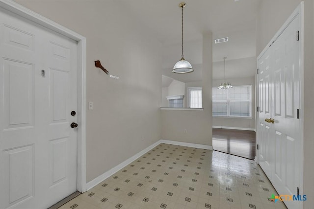 2121 Keystone Dr, New Braunfels, TX 78130 - entryway featuring baseboards and a chandelier
