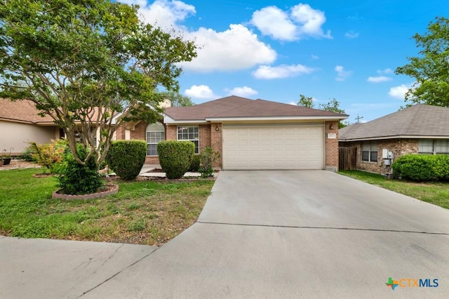 2121 Keystone Dr, New Braunfels, TX 78130 - single story home with brick siding, an attached garage, concrete driveway, and a front lawn