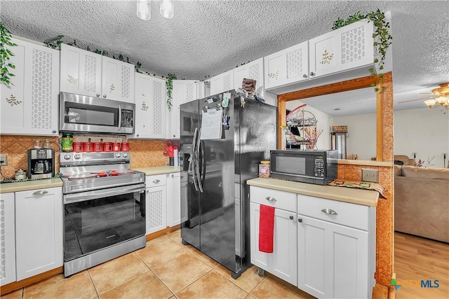 3602 Bacon Ranch Rd, Killeen, TX 76542 - kitchen featuring black appliances, light countertops, a textured ceiling, and decorative backsplash
