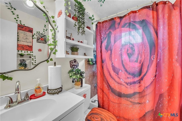3602 Bacon Ranch Rd, Killeen, TX 76542 - full bathroom featuring vanity, curtained shower, toilet, and a textured ceiling