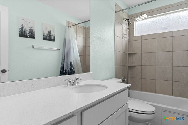 421 Perfect World Loop, Jarrell, TX 76537 - full bath with toilet, vanity, shower / bath combo, and a textured wall