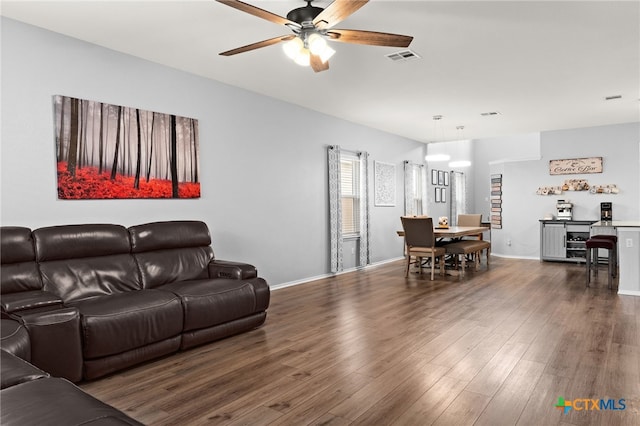 421 Perfect World Loop, Jarrell, TX 76537 - living room with ceiling fan, wood finished floors, and baseboards