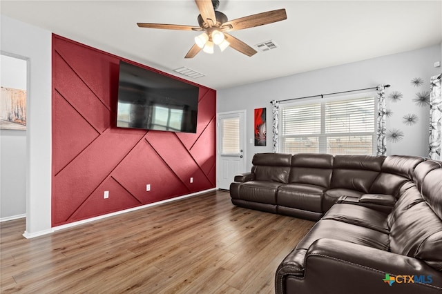 421 Perfect World Loop, Jarrell, TX 76537 - living room with ceiling fan, wood finished floors, and baseboards