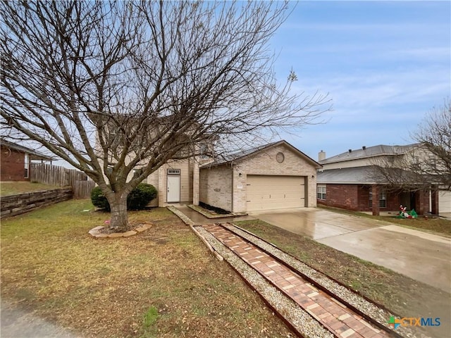 single story home with a garage, an outbuilding, and a front lawn