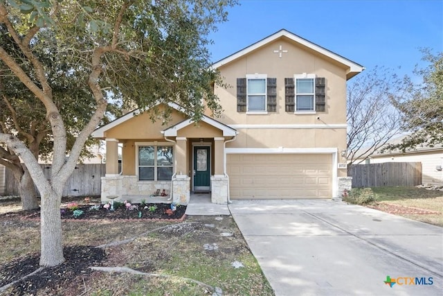 traditional home with stone siding, stucco siding, driveway, and fence