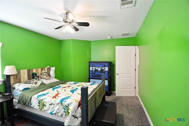 carpeted bedroom with visible vents, baseboards, and ceiling fan