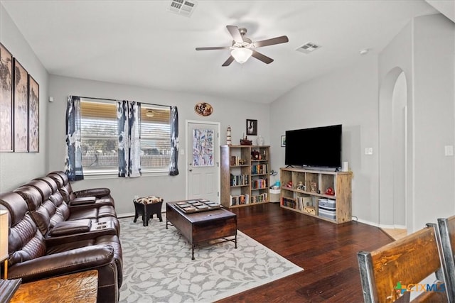 living room featuring arched walkways, visible vents, ceiling fan, and lofted ceiling