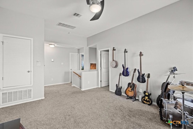 workout room with visible vents, ceiling fan, and carpet