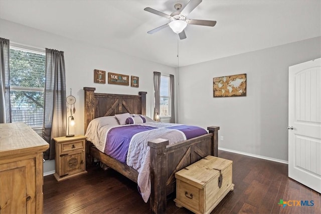 bedroom featuring dark hardwood / wood-style floors and ceiling fan