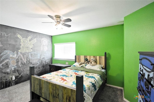 carpeted bedroom with baseboards and a ceiling fan