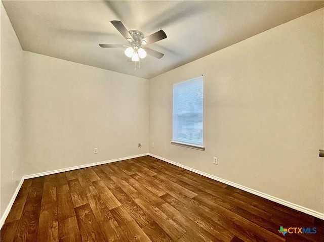 1009-1019 Advance St, San Marcos, TX 78666 - empty room with baseboards, dark wood-style flooring, and a ceiling fan