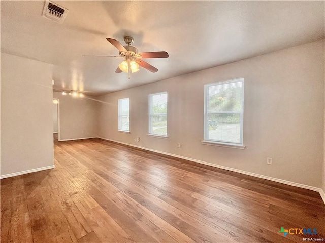 unfurnished room featuring wood-type flooring and ceiling fan