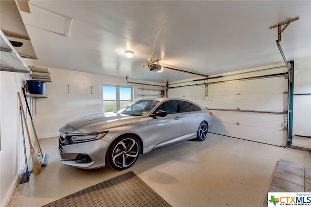 garage featuring a garage door opener