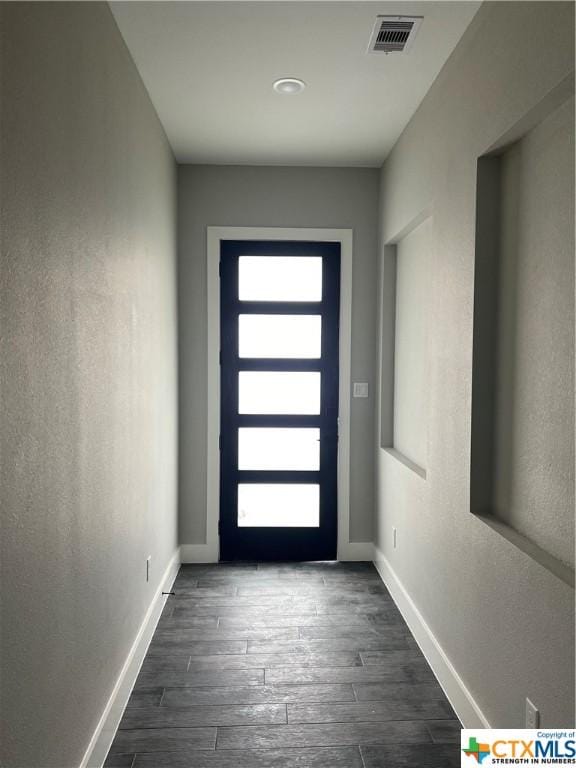303 Claret, Port Lavaca, TX 77979 - entryway featuring baseboards and dark wood-style floors