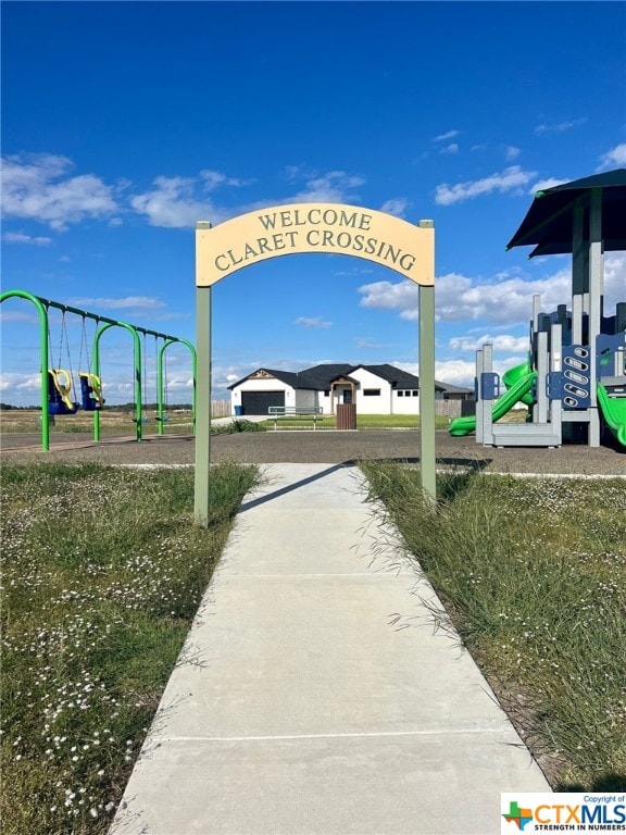 view of home's community featuring a playground