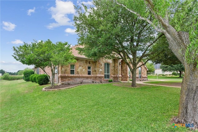 1332 Walker Cir, Salado, TX 76571 - obstructed view of property with brick siding and a front lawn