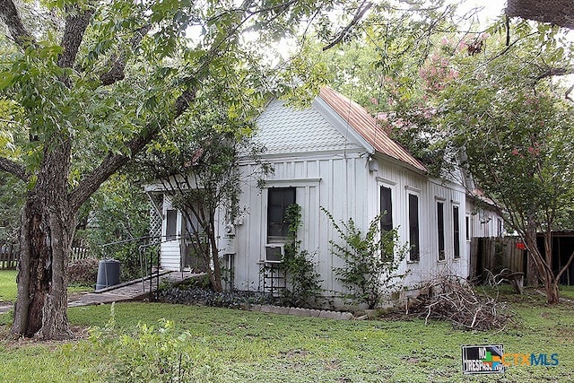 view of property exterior featuring a yard