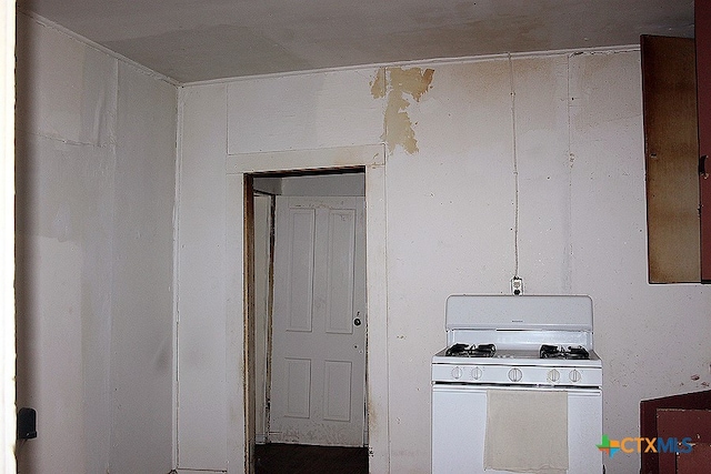 kitchen with white gas range oven