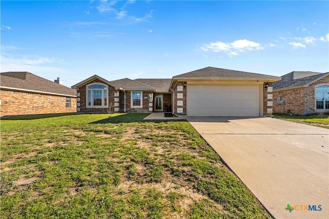 3705 Armstrong County Ct, Killeen, TX 76549 - ranch-style home featuring brick siding, concrete driveway, a garage, and a front lawn