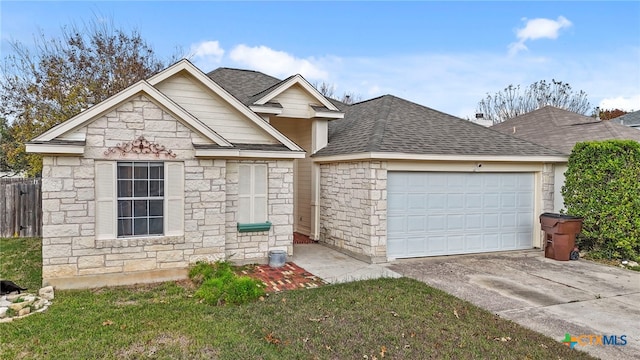 view of front facade featuring a front lawn and a garage