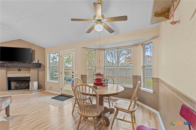 dining area featuring lofted ceiling, ceiling fan, and light hardwood / wood-style floors