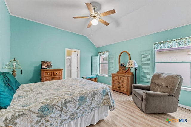 bedroom with ceiling fan, vaulted ceiling, and light wood-type flooring