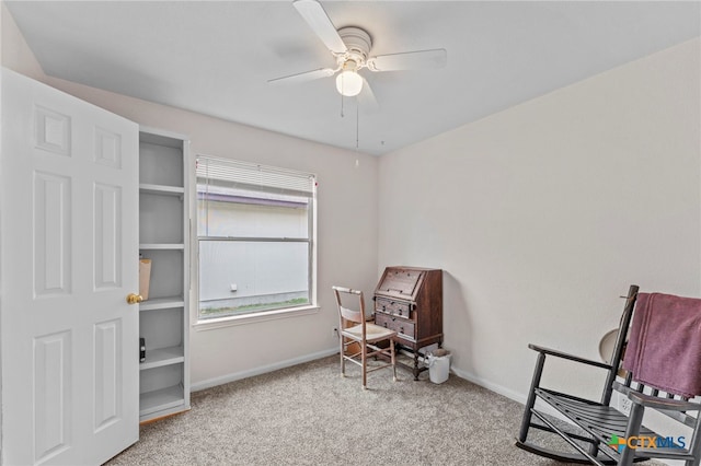 sitting room featuring ceiling fan and light carpet