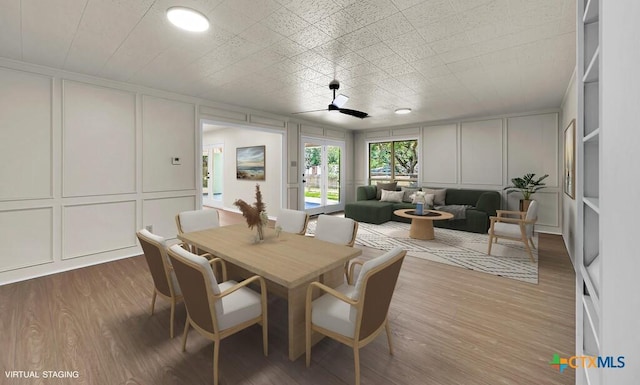 309 E Xavier Ave, Temple, TX 76501 - dining space with a decorative wall and wood finished floors
