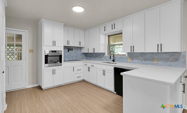 309 E Xavier Ave, Temple, TX 76501 - kitchen featuring black appliances, light wood-type flooring, backsplash, white cabinets, and light stone counters