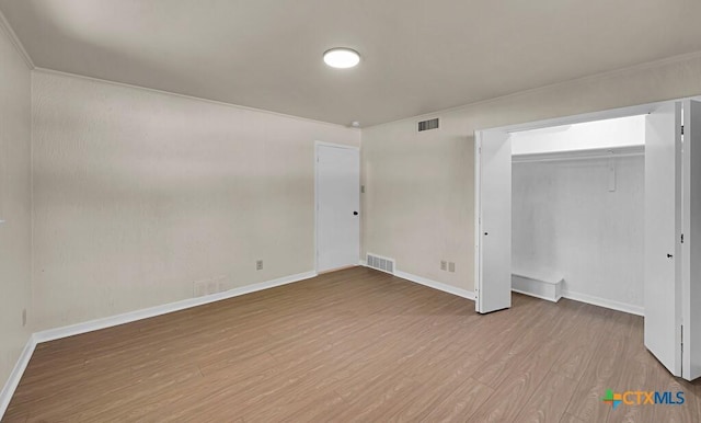 309 E Xavier Ave, Temple, TX 76501 - unfurnished bedroom featuring wood finished floors and a closet