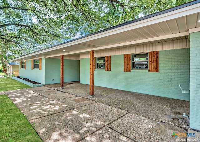 309 E Xavier Ave, Temple, TX 76501 - view of property exterior featuring a carport and brick siding