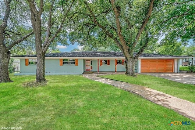 309 E Xavier Ave, Temple, TX 76501 - ranch-style house featuring a garage, concrete driveway, covered porch, and a front yard
