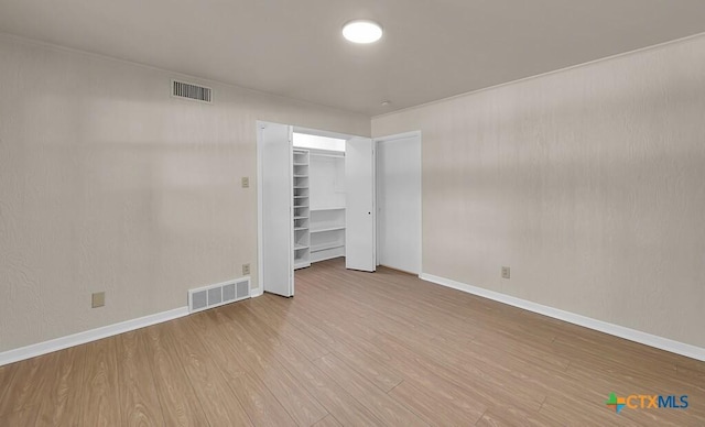 309 E Xavier Ave, Temple, TX 76501 - unfurnished bedroom featuring baseboards and wood finished floors
