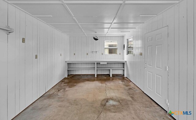 309 E Xavier Ave, Temple, TX 76501 - interior space with concrete flooring and wooden walls