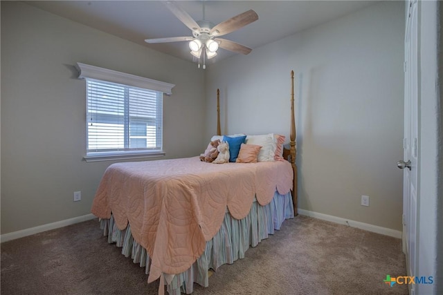 carpeted bedroom featuring baseboards and a ceiling fan