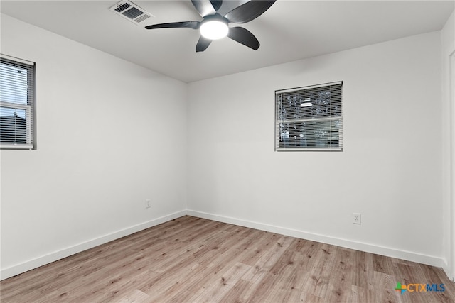 spare room featuring ceiling fan and light wood-type flooring