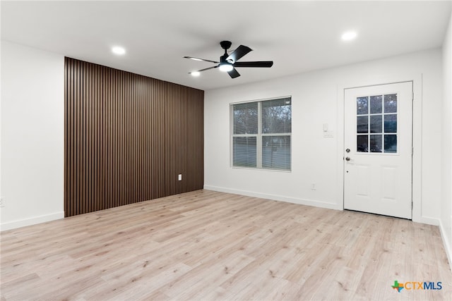 interior space featuring ceiling fan and light wood-type flooring