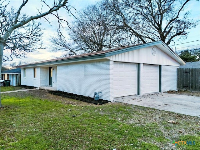 garage with a lawn