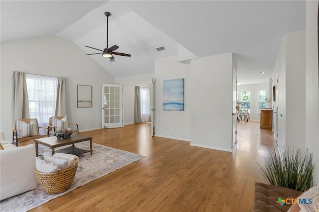 2002 E Young Ave, Temple, TX 76501 - living area with a ceiling fan, light wood-style floors, lofted ceiling, and baseboards