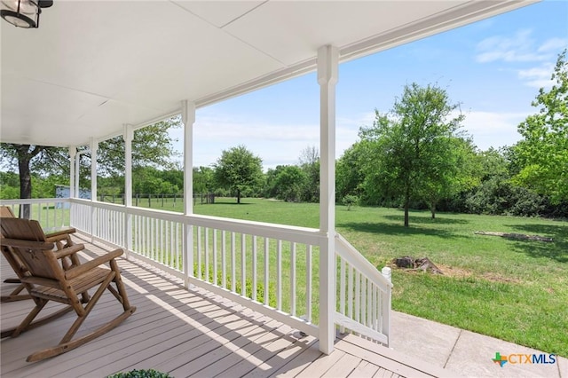 2002 E Young Ave, Temple, TX 76501 - wooden terrace with a lawn and view of scattered trees